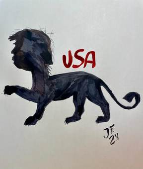 Un mono negro caminando junto a las letras «USA»