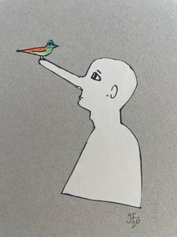 Perfil recortado en papel blanco con un pájaro de colores posado en la nariz