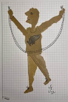 Figura de papel dorado con una cuerda, sobre papel cuadriculado