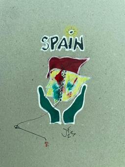 Dos manos sosteniendo una bandera y la palabra «Spain»